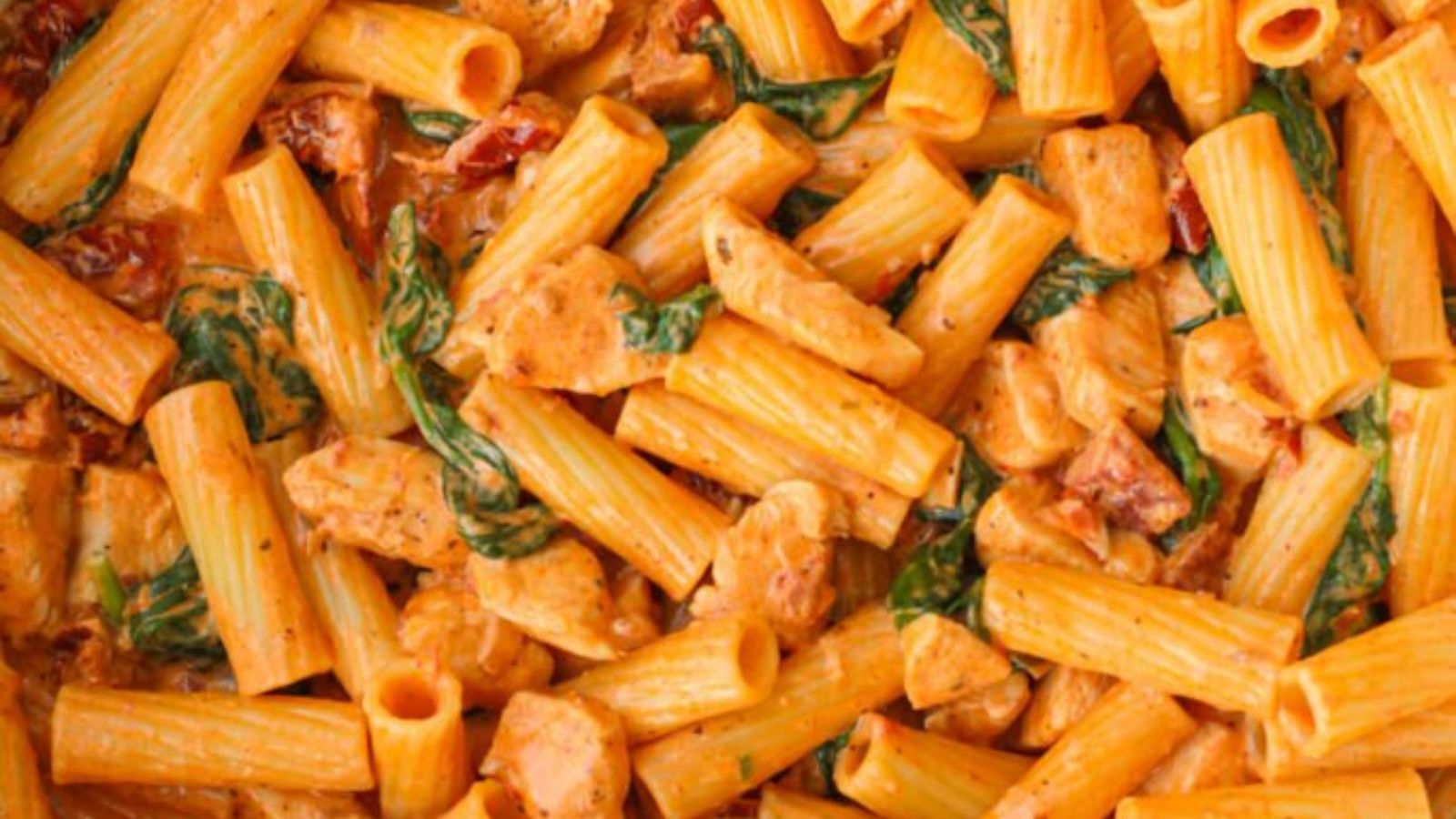 Creamy marry me pasta with sun-dried tomatoes, basil, and parmesan in a rustic skillet